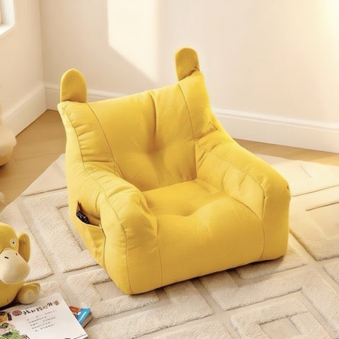 Yellow bean bag chair with bear ears on a light wooden floor.
